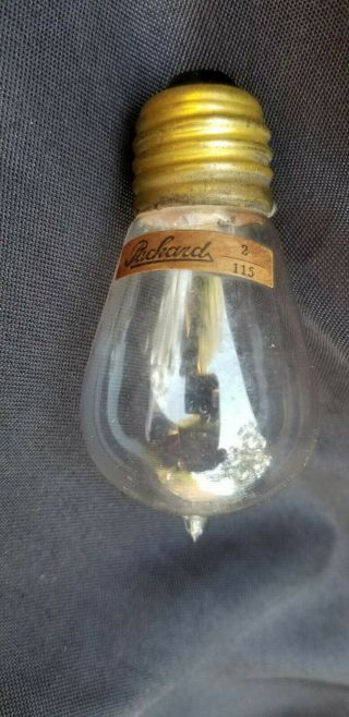 Antique Light Bulb With Nipple Made By Packard With Label