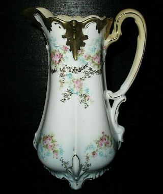 R.  S.  Prussia Hand Painted Moriage Embossed Porcelain Footed Pitcher,  Ewer
