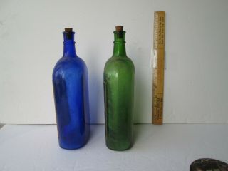 two antique labeled ammonia bottles 9.  5 in tall blue&green norfolk va.  & buffalo 2