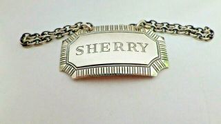 A Plain Curved Silver " Sherry " Decanter Wine Label,  1976