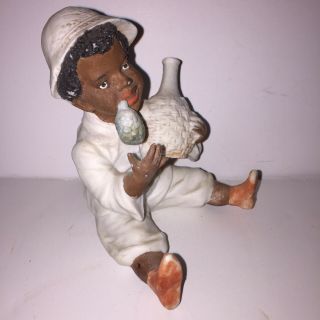 Antique Black Americana Bisque Figurine Of A Black Boy Sitting On The Ground. 3