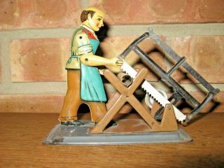 Rare Vintage Antique Tin Toy Man Sawing Cutting Wood