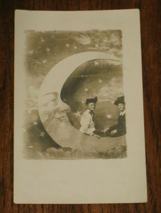 Rppc 2 Old Women With Big Hats Sitting On Paper Moon Antique Real Photo Postcard