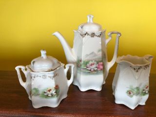 Antique Germany Porcelain Floral Teapot,  Creamer,  Lidded Sugar Set