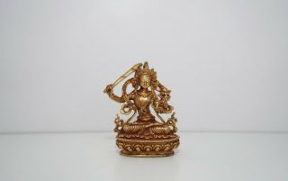 A Small Bronze Figure Of Manjushri