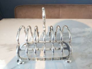 An Antique Silver Plated Toast Rack By Walker And Hall.  Sheffield.  Early 1900.  S