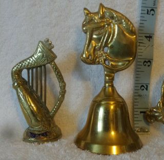 3 Vintage Brass ornaments.  1 bell with horse head 1Harp and 1 bird Ring dish. 2