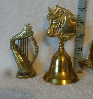 3 Vintage Brass ornaments.  1 bell with horse head 1Harp and 1 bird Ring dish. 3