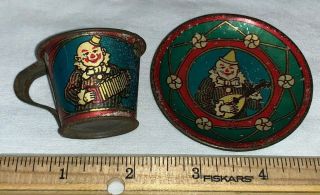 Antique Tin Litho Toy Tea Set Cup Saucer Plate Clown W/ Instrument Unusual Old
