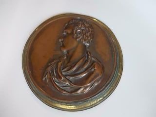 203 / A 19th Century Cast Metal Plaque Having A Copperised Surface Finish