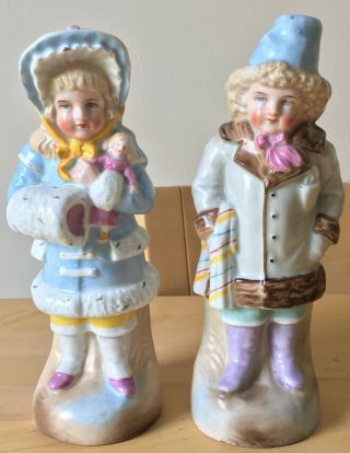 Antique German Porcelain Girl & Boy In Winter Clothing Figurines