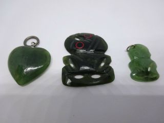 Three Antique Dark Green Carved Jade Pedants