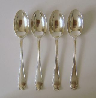 A Set Of Four Ornately Embossed Sterling Silver 10.  8 Cms Spoons London 1939