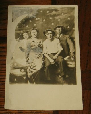 Rppc 2 Couple With Hat,  Whip Standing By A Paper Moon Antique Real Photo Postcard
