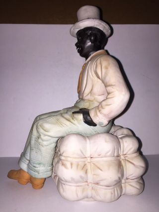 Black Americana Well Dressed Black Man Sitting On A Bale Of Cotton.  Bisque.  Rare 3