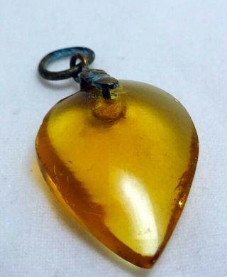An Antique Early 19th Century Amber Coloured Glass Witches Heart Pendant