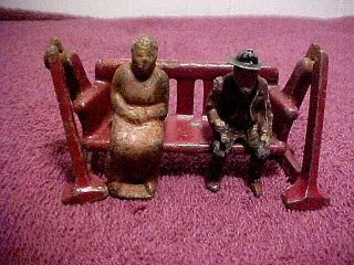 Antique Cast Iron Toys: Man & Woman On Swing