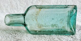 Small Crude Antique Aqua Croupline Cough Syrup Bottle.