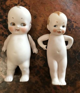 Two Vintage Adorable Porcelin Boy Dolls - - Side Glancing With Jointed Arms