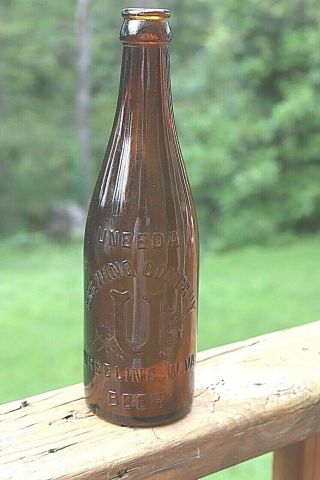 Antique Brown Embossed Uneeda Brewing Company Wheeling W.  Va.  Beer Bottle