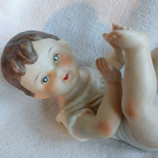 Vintage Piano Baby Brunette Boy Lying on Back Feet Up Porcelain Bisque Figurine 2
