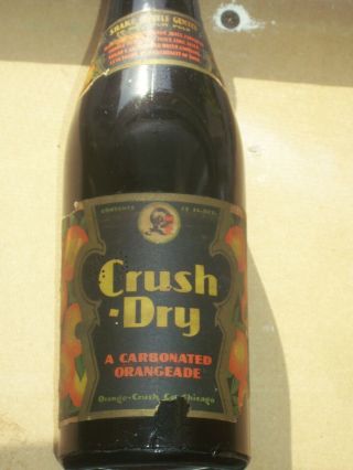 Rare 12 Oz.  Black Glass,  Paper Label Crush Dry Carbonated Orangeade Bottle