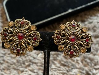 Vintage “ Antique Gold “ Tone Red Rhinestone Flower Avon Clip Earrings