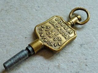 Antique Advertising Pocket Watch Brass Key John A.  Jackson 68 High St Scunthorpe
