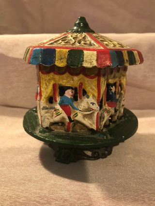 Antique Painted Cast Iron Music Box Carousel Rotating Iron Merry Go Round