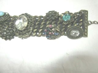 Antiqued brass tone linked bracelet with rhinestone buttons and charm accents 3