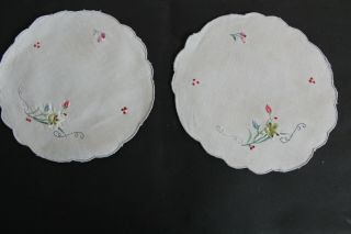Two Vintage Off - White Round Doilies With Hand Embroidered Red And Blue Flowers.