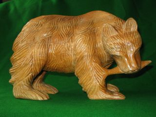 Black Forest Carved Wooden Bear With Salmon.  10 ½” Long.
