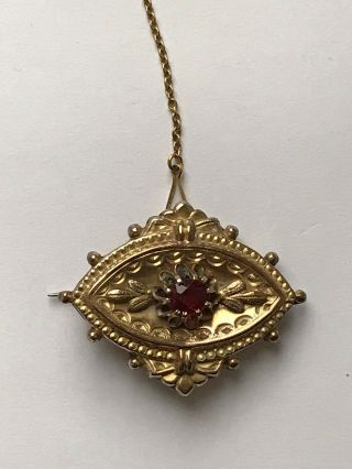 Antique Victorian Gold Plated Ornate Brooch With A Ruby Coloured Stone