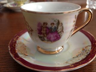 Vintage Demitassi Cup And Saucer " Japan " Mother Of Pearl,  Gold Trim,  Couple On