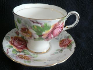 PARAGON TEA CUP AND SAUCER PINK YELLOW ROSES WITH SCATTERED LEAVES FOOTED N 2