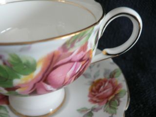 PARAGON TEA CUP AND SAUCER PINK YELLOW ROSES WITH SCATTERED LEAVES FOOTED N 3
