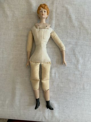 Vintage Bisque Doll with Molded Red Hair,  Blue Eyes,  and Cloth Body 2