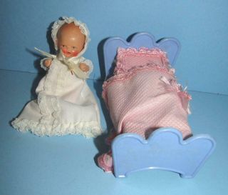 Cute 3 1/2 Inch Bisque Baby Doll In Cute Outfit And Comes With Bed For Display