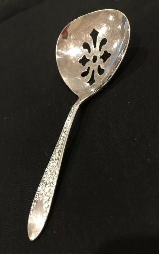 Vintage Serving Spoon Pierced,  National Silver Co A1,  Measures 4 3/4 Inches.