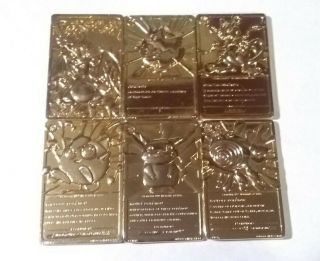 6 Pokemon 1999 Charizard,  Pikachu,  Mewtwo,  Togepi Gold Metal Plated Trading Cards
