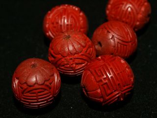 One (1) 15mm Vintage Chinese Carved Shou Symbol Red Cinnabar Carved Wooden Bead