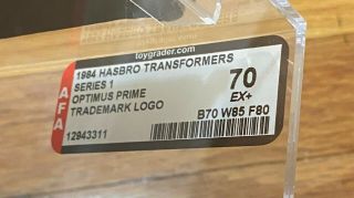 1984 Hasbro TRANSFORMERS Series 1 Optimus Prime Trademark Logo AFA 70 2
