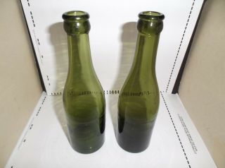 2 antique green whiskey/wine/beer bottles,  spun in mold,  no seam lines,  early crown 2