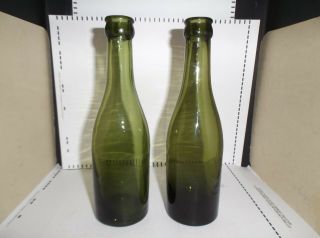 2 antique green whiskey/wine/beer bottles,  spun in mold,  no seam lines,  early crown 3