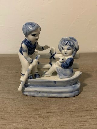 Blue And White Dutch Figurine Of Boy And Girl In Boat