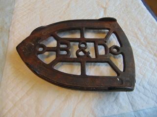 Antique B & D Sad Iron Trivet,  3 Feet,  Cast Iron,  4 1/4 " X 6 ",