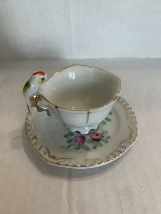 Miniature Teacup And Saucer With Parrot Handle
