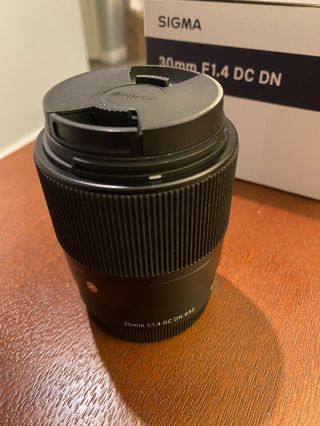 Sigma 30mm f/1.  4 DC DN Lens for Sony In Great Shape.  Rarely. 2