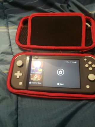 Nintendo Switch Lite - Gray W/ Black And Red Case: Rarely.