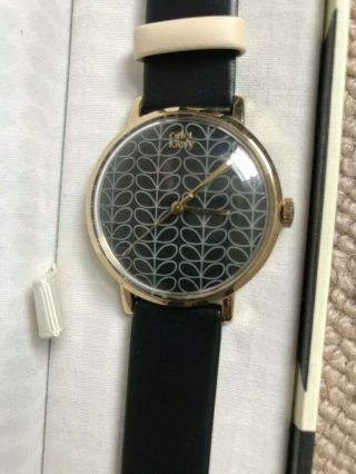 Orla Kiely Round watch gold case/black leather Strap,  brand 3